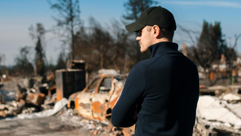 Featured Image – Emotional Challenges After a Disaster A man visiting the scene of a disaster