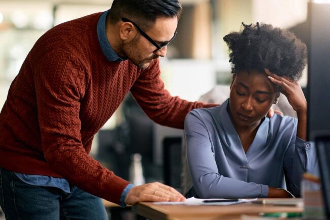 Featured Blog Image: Providing Support After a Loss A coworker Providing Support After a Loss to an employee who is upset