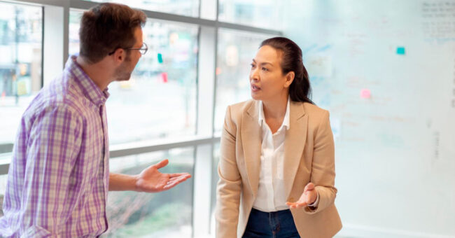 Blog Featured Image – Managing During an Election Year Multiracial work colleagues having meeting in modern business office