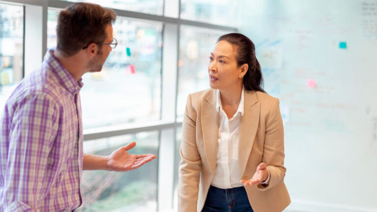 Blog Featured Image – Managing During an Election Year Multiracial work colleagues having meeting in modern business office