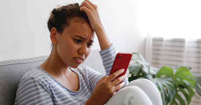 Blog Featured Image_Becoming a Savvy News Consumer Sad lonely person at home