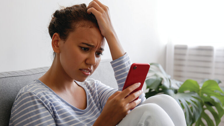 Blog Featured Image_Becoming a Savvy News Consumer Sad lonely person at home