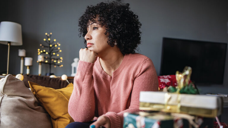 Change and the Holidays Portrait of a woman at home, feeling sad