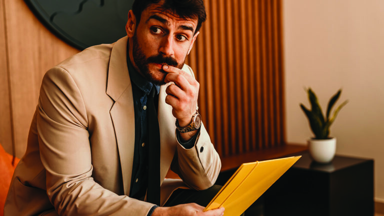 Blog Featured Image_Coping with Nervousness A nervous male candidate waiting for the human resource team for a job interview in the office.