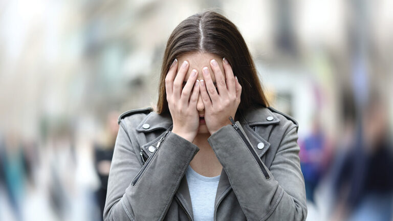 Reactions to a Traumatic Event Woman suffering anxiety attack on city street