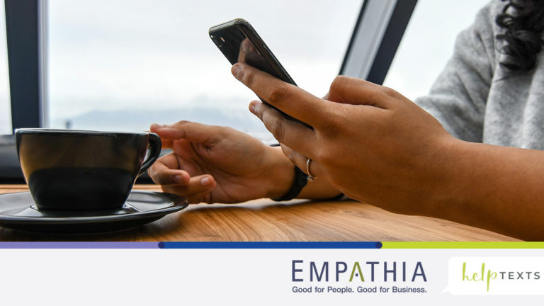 Person Holding Ceramic Cup on Table Typing on Cell Phone Person Holding Ceramic Cup on Table Typing on Cell Phone
