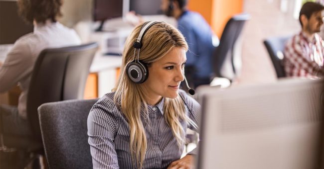 Empathia Call Center Case Study Featured Image Woman in a call center assisting a client