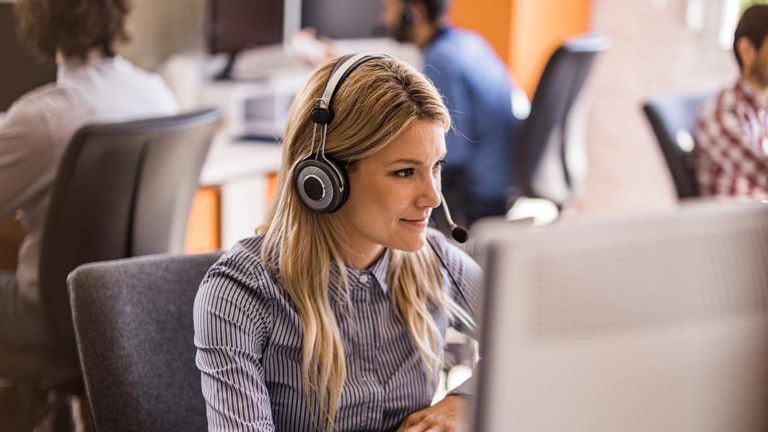 Empathia Call Center Case Study Featured Image Woman in a call center assisting a client