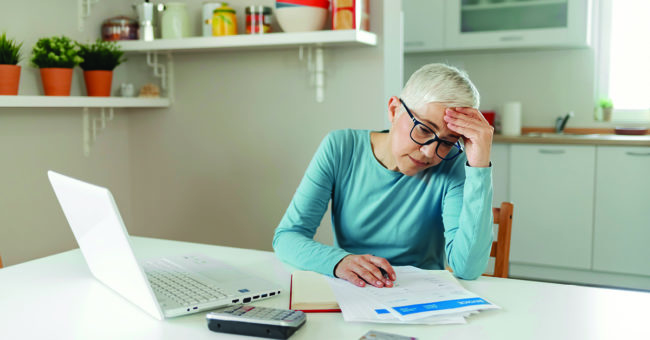 Woman looking over her financial statements
