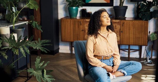 Episode 17 – Mental Health Around the World, Part 2 Peace, relax and happy mindset of a woman from Indonesia taking a mind and meditation home break. Happiness of woman on a house living room lounge chair thinking about life, gratitude and self care