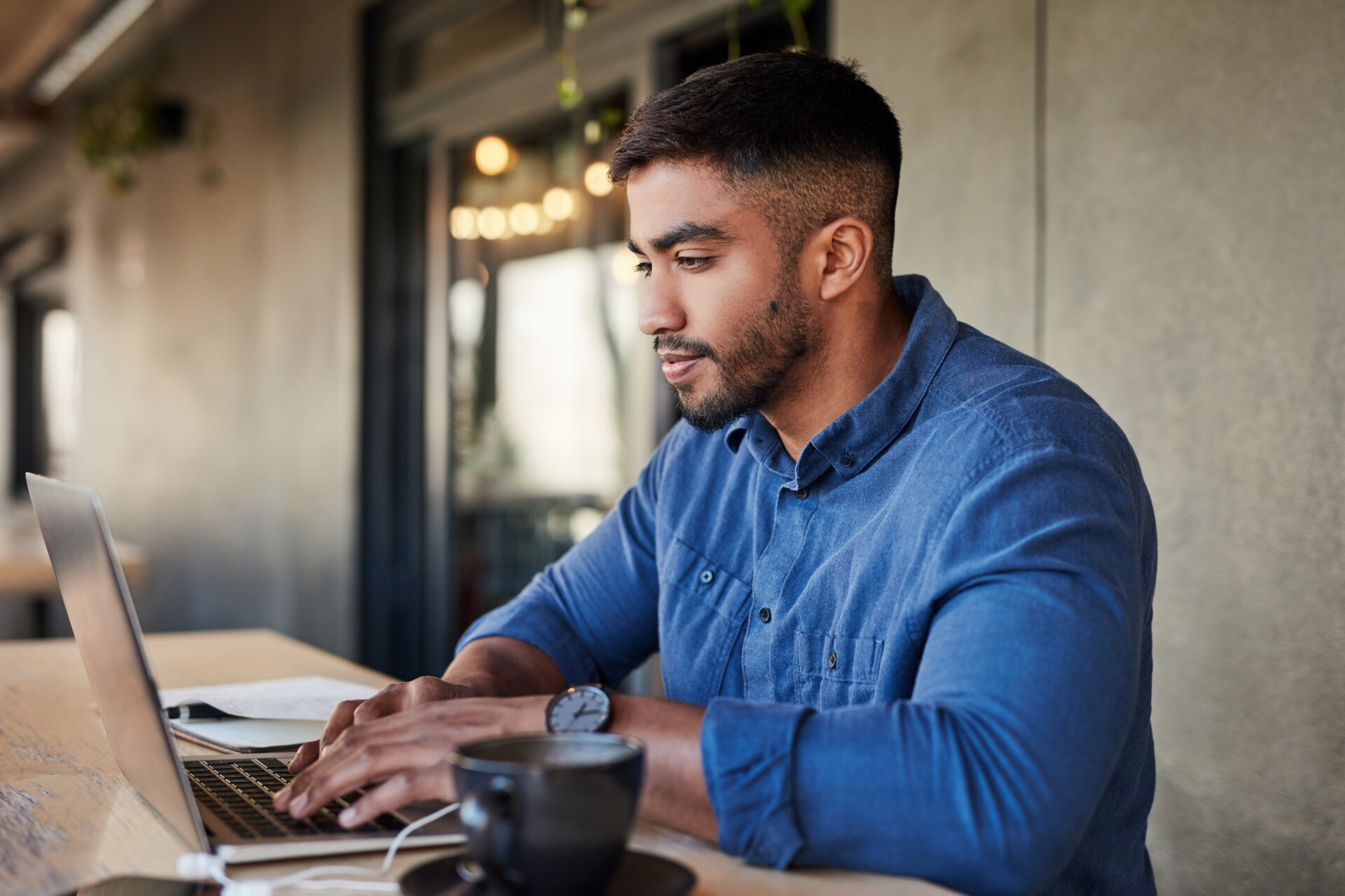 Worker, thinking or typing on laptop in cafe, coffee shop or restaurant on startup ideas, vision or web design ux. Creative designer, businessman or technology in remote work iot or strategy planning