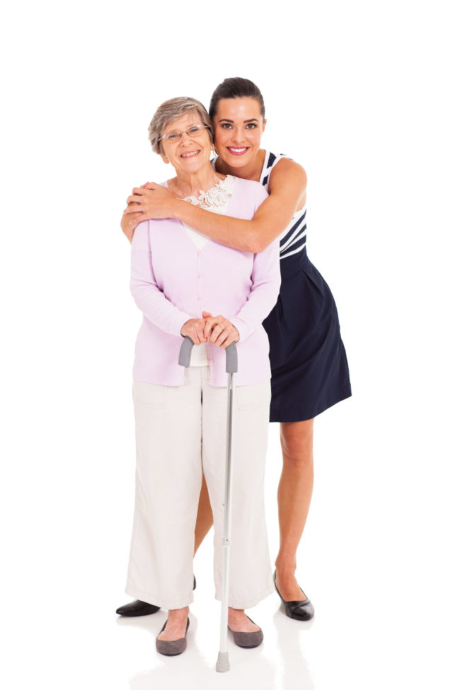 adult granddaughter and senior grandmother a woman hugging her grandma