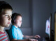Two young children playing video games