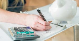 Young girl writing in binder