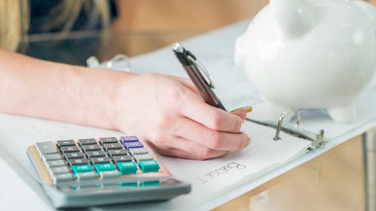 Writing In Binder Young girl writing in binder