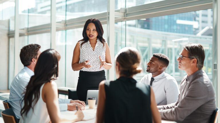 Offering Encouragment Shot of a group of businesspeople having a meeting in a modern office