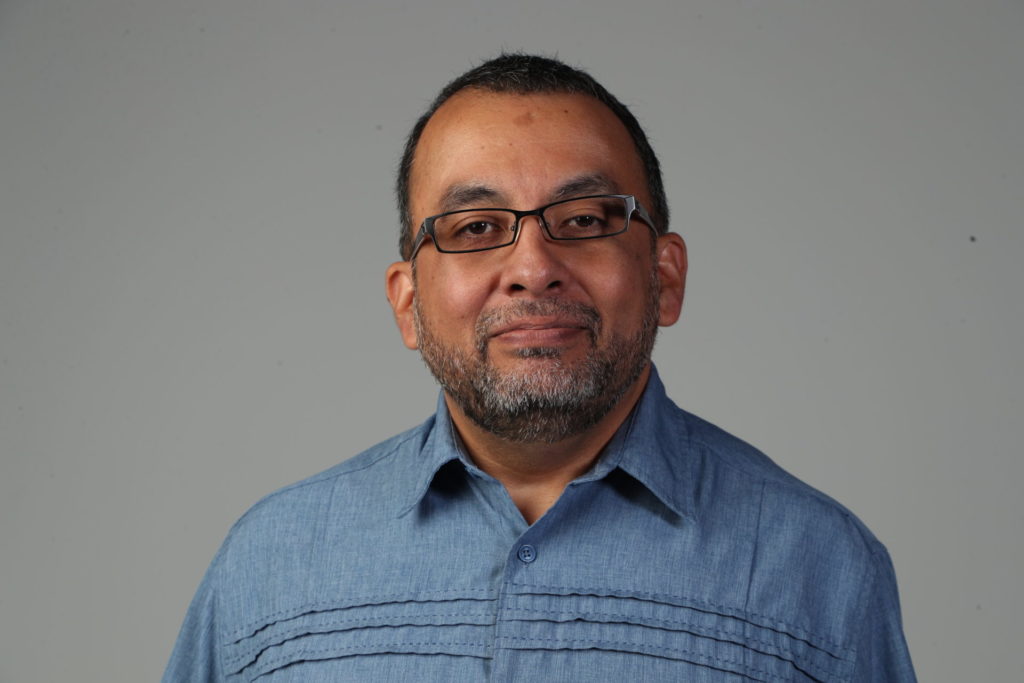 hispanic man with glasses 