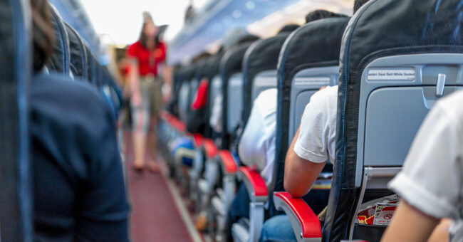 Podcast Featured Image – Episode 48 – Afraid to Fly A group of travelers seated in an airplane