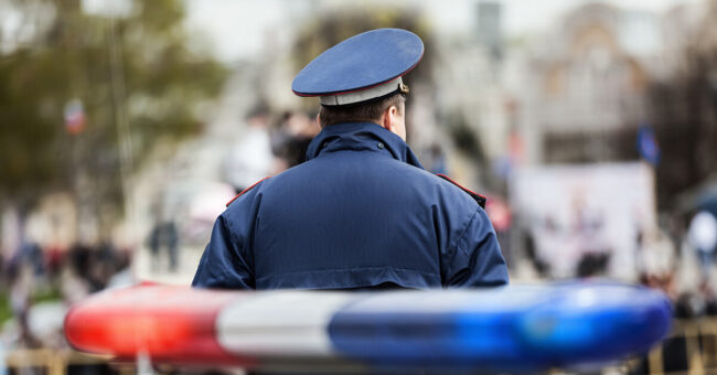 Podcast Featured Image – Episode 51 Cover Police officer standing at scene