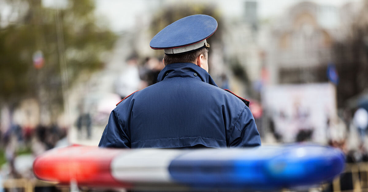 Podcast Featured Image – Episode 51 Cover Police officer standing at scene