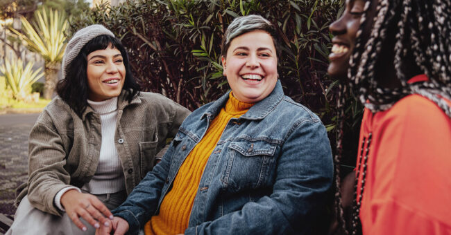 Podcast Featured Image – Episode 55 3 friends sitting outside laughing