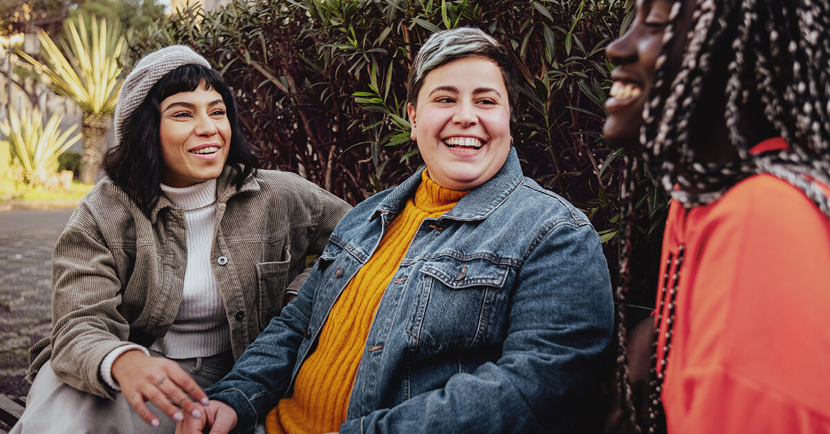 Podcast Featured Image – Episode 55 3 friends sitting outside laughing