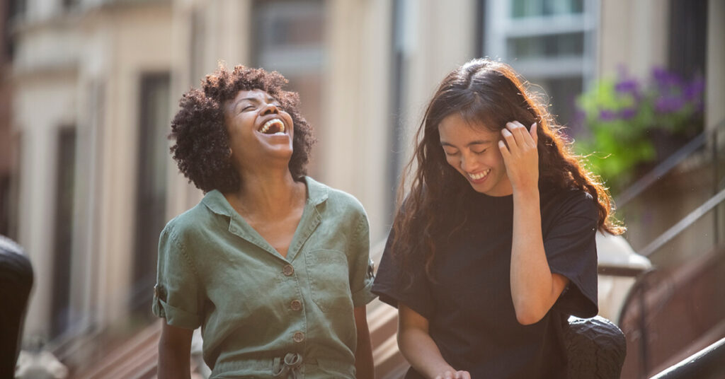 Friends laughing together outside