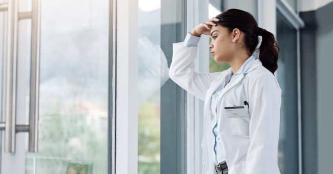 A caregiver dealing with stress. Self-care techniques can help with the everyday stress that caregivers experience.