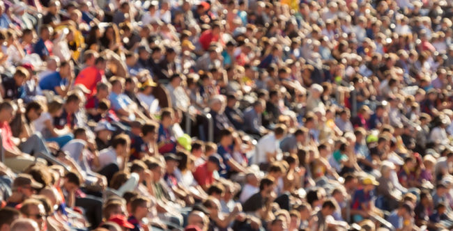 Blurred crowd in stadium Blurred out people attending an event at an outdoor stadium