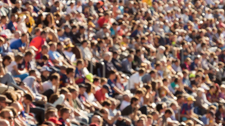 Blurred crowd in stadium Blurred out people attending an event at an outdoor stadium