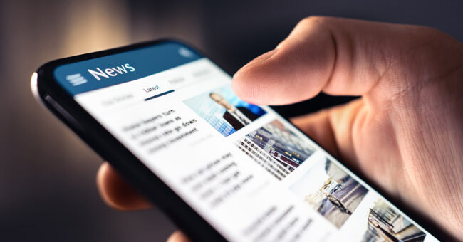 News feed in phone. Watching and reading latest online articles and headlines from smartphone newspaper mobile app. Daily digital information portal and publication. Media and press on internet. News feed in phone. Watching and reading latest online articles and headlines from smartphone newspaper mobile app. Daily digital information portal and publication. Media and press on internet.