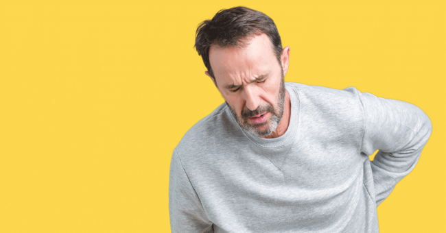 chronic-pain-featured-image Handsome middle age senior man wearing a sweatshirt over isolated background Suffering of backache, touching back with hand, muscular pain