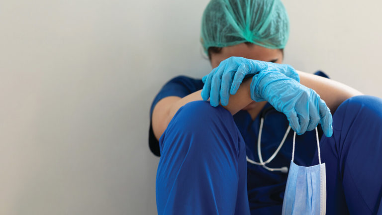 despression-among-physicians-featured-image Stressed tired healthcare worker sitting on floor