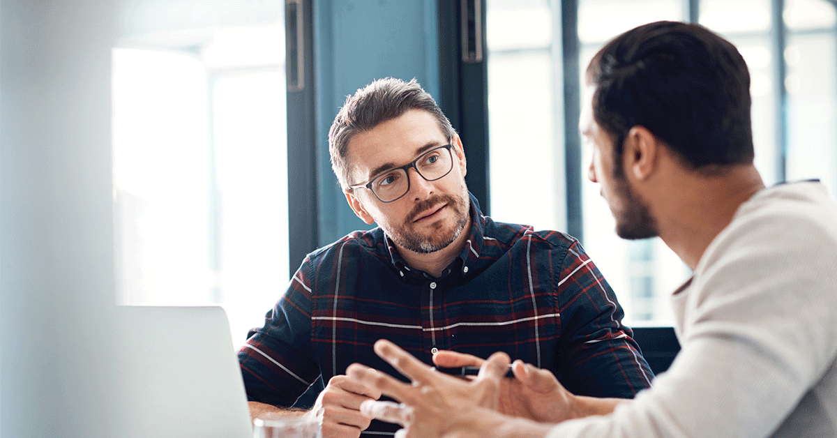 Shot of two businessmen having a discussion in an office