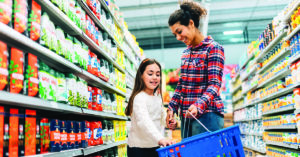 Mother and Daughter Shopping in Supermarket