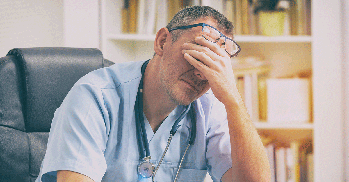 Overworked doctor sitting in his office