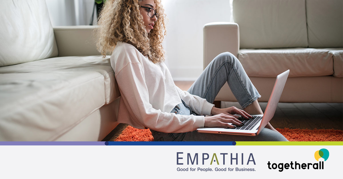 Woman typing on a computer with a concerned look on her face.